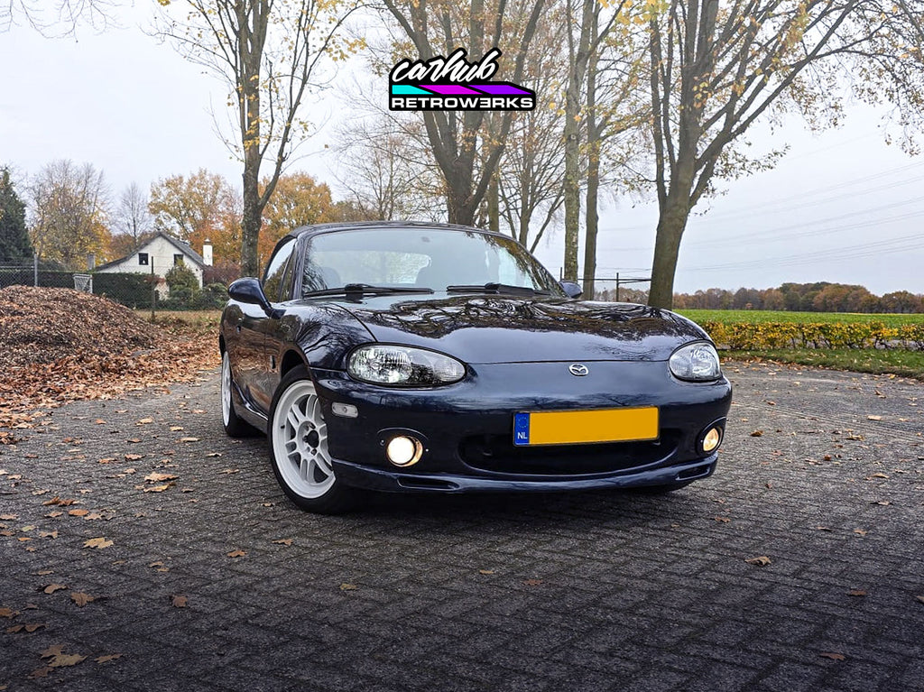 NB1 Mazda MX-5 Miata MK2 featuring gloss black insert restored original headlights by carhub retrowerks