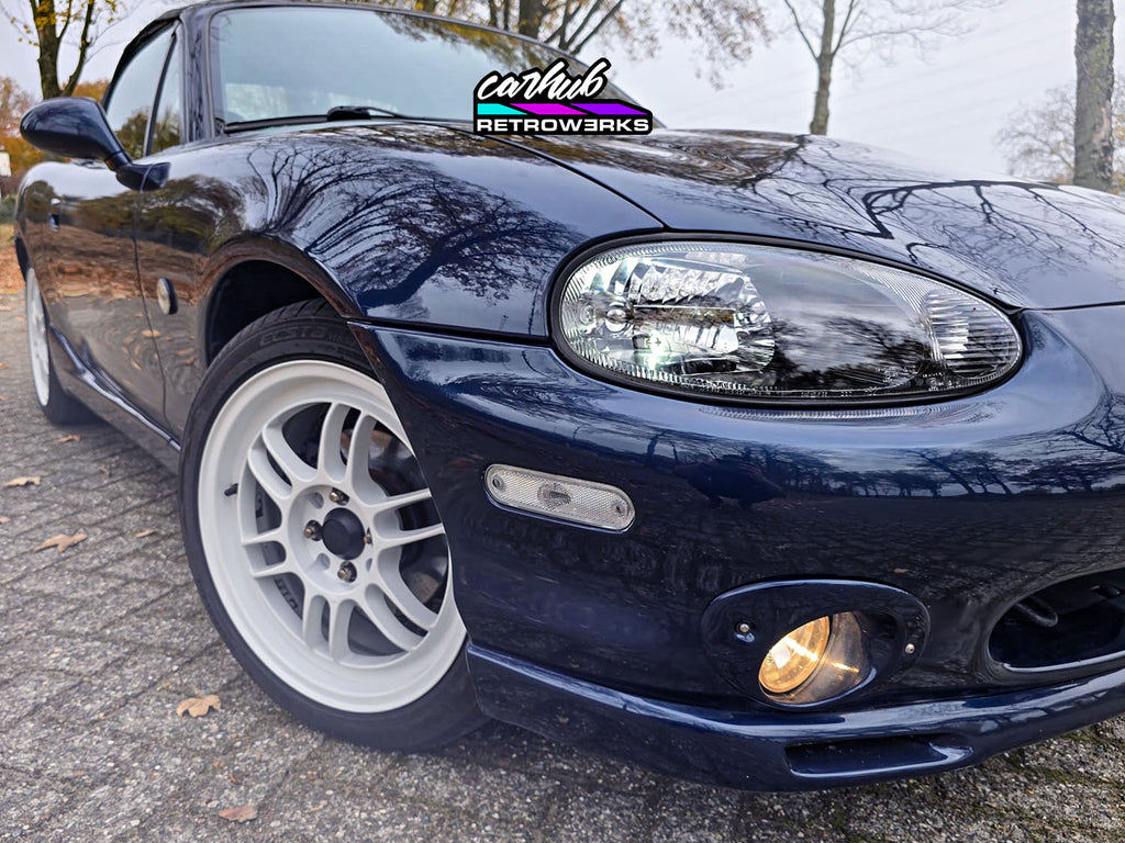 NB1 Mazda MX-5 Miata MK2 featuring gloss black insert restored original headlights by carhub retrowerks