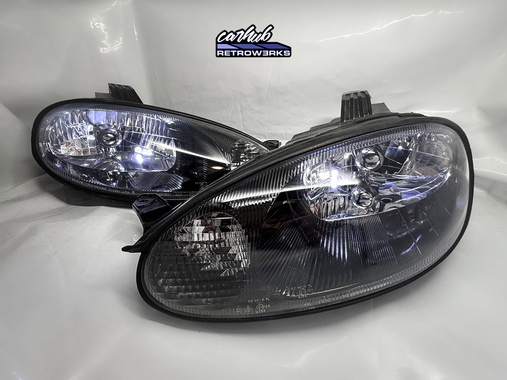 Mazda MX-5 NB Miata carhub retrowerks restored black housing oem+ headlights