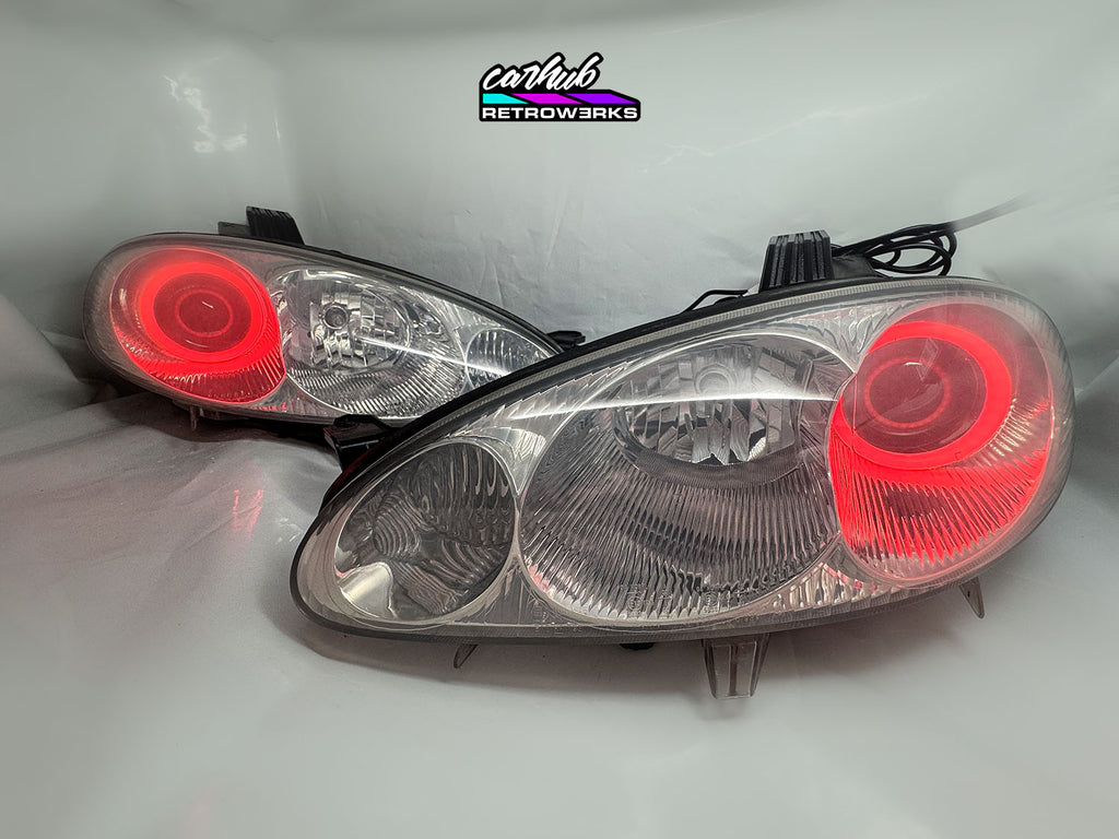 NB Mazda MX-5 Miata Clear headlights retrofitted with rgb halos showcase white background