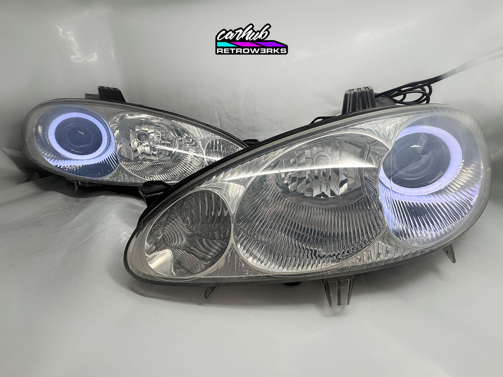 NB Mazda MX-5 Miata Clear headlights retrofitted with rgb halos showcase white background