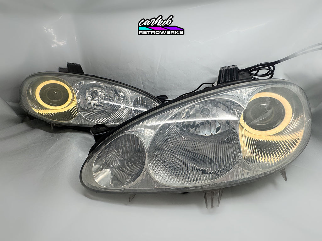 NB Mazda MX-5 Miata Clear headlights retrofitted with rgb halos showcase white background