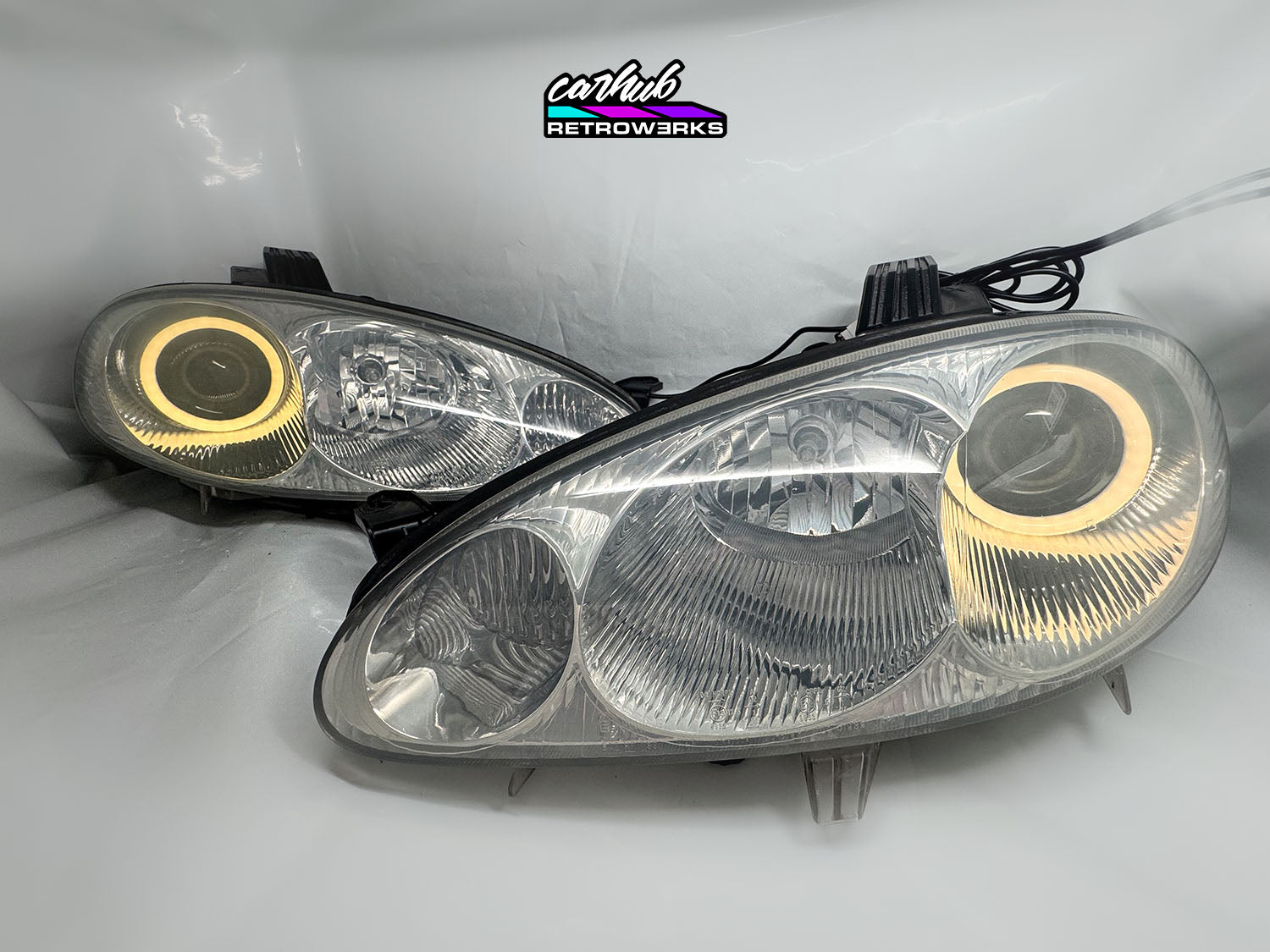 NB Mazda MX-5 Miata Clear headlights retrofitted with rgb halos showcase white background