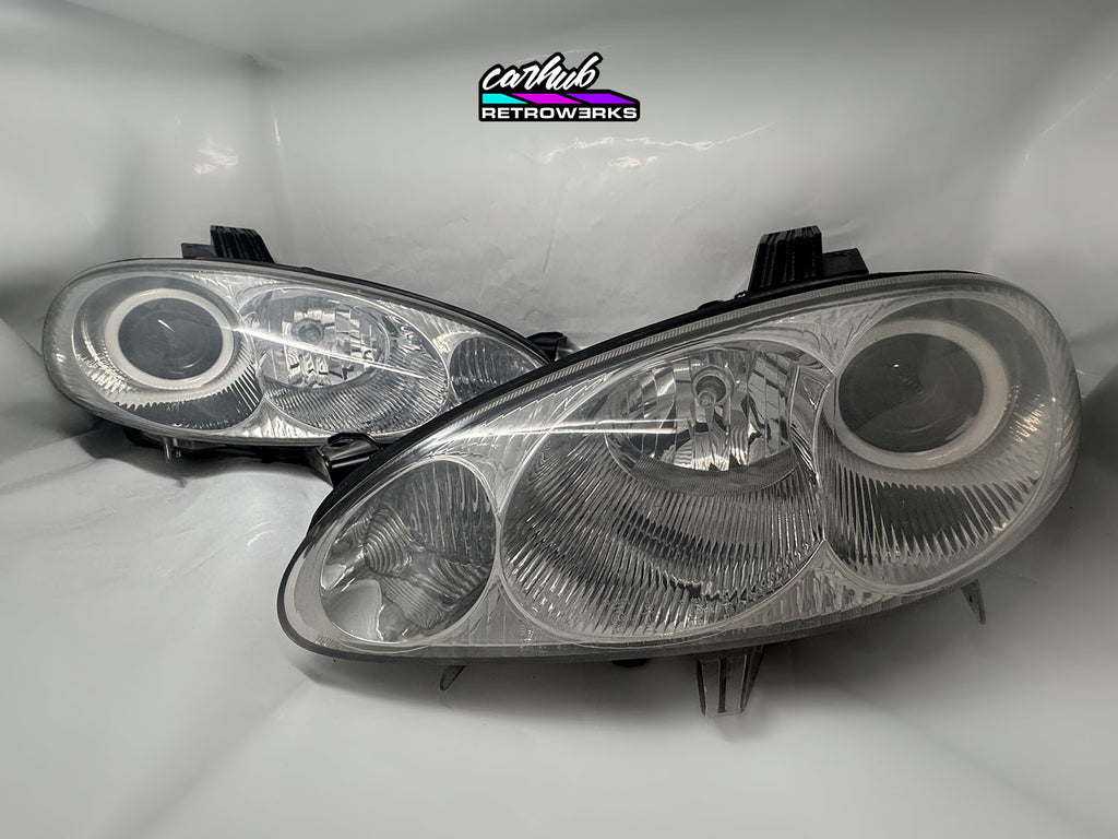 NB Mazda MX-5 Miata Clear headlights retrofitted with rgb halos showcase white background