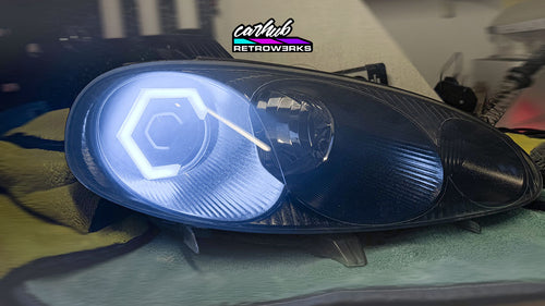 NB Mazda MX-5 Miata black headlights retrofitted with hexagon white halos