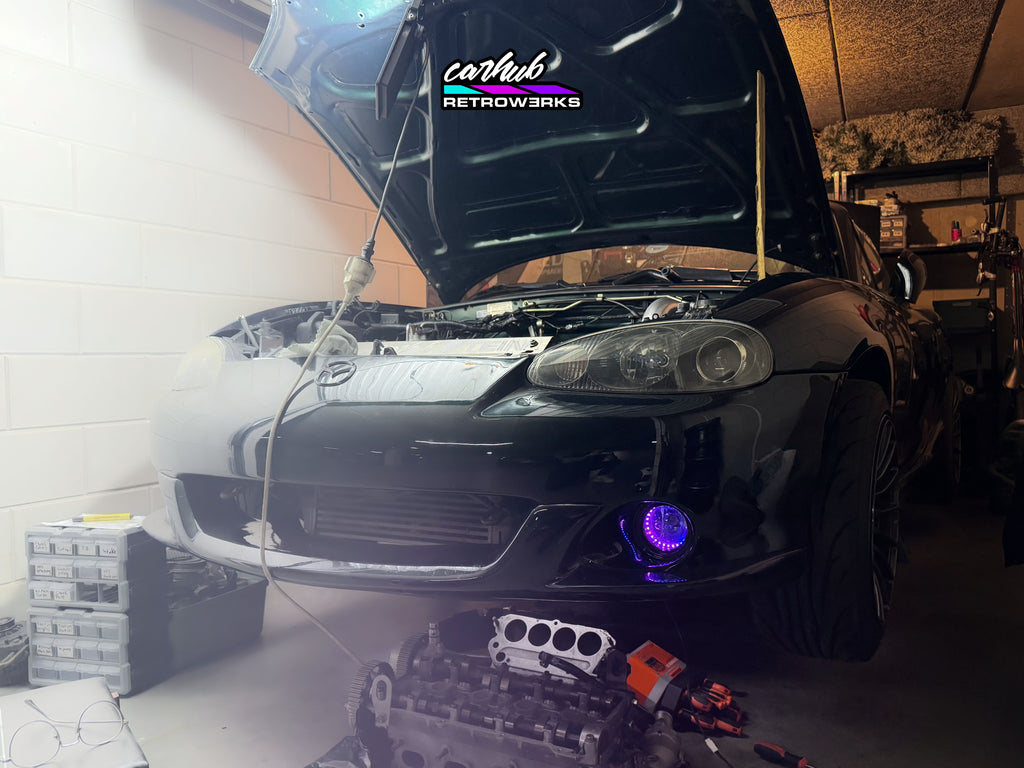 NB2 MK2.5 Mazda MX-5 Miata featuring Carhub retrowerks RGB halo retrofitted foglights purple mode