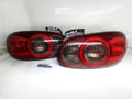 Customized OEM NB2 Mazda Miata Taillights with Halos and Strips in a white background