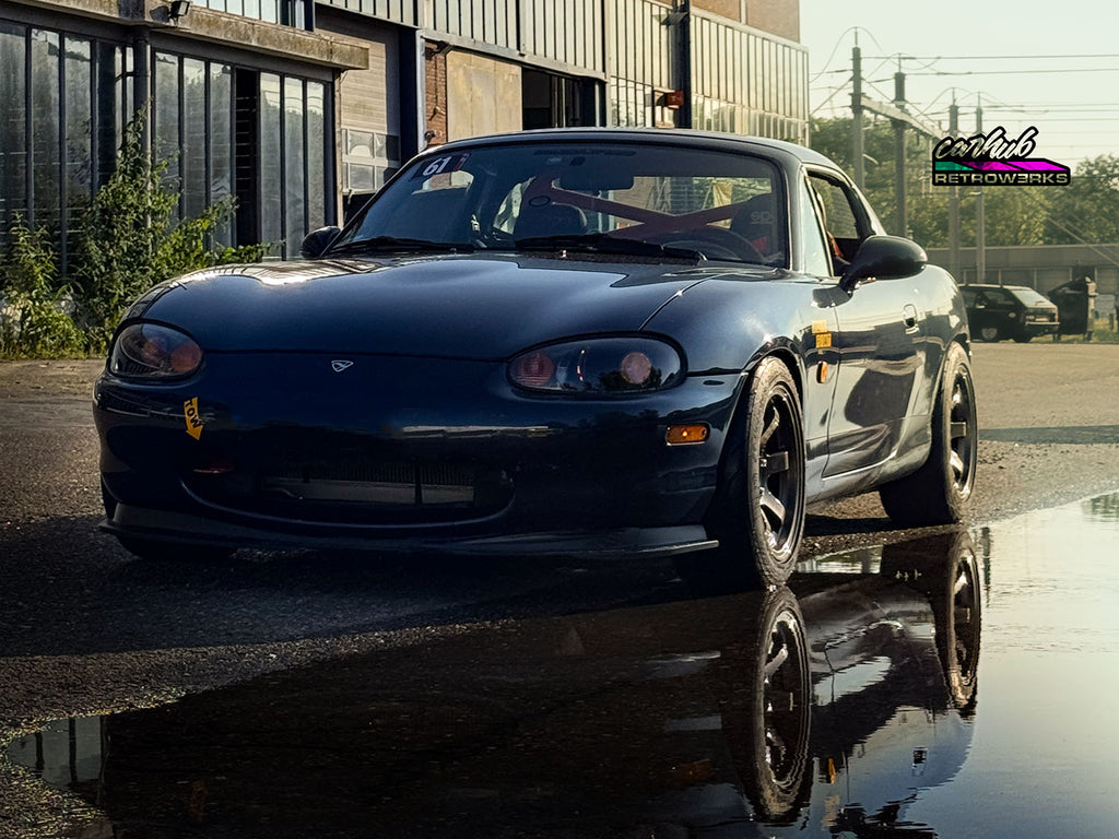 mazda mx5 nb nb1 miata mk2 with 3 inch projector retrofit gloss black interior and demon eyes set to orange