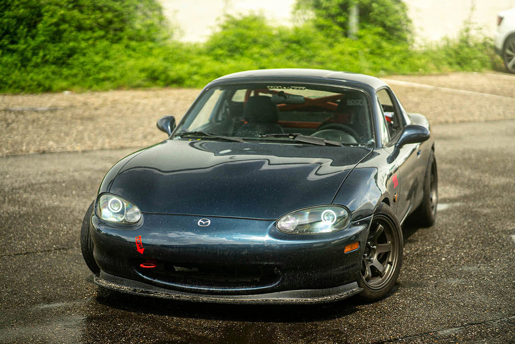 mazda miata nb1 nb with dark retrofit projector headlights and white halos turned on